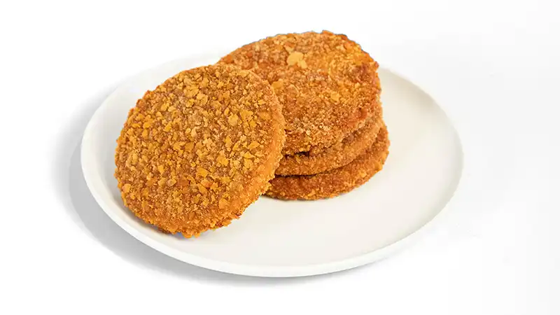 the-asia-company-neuigkeiten-planted_chicken-patty planted.chicken paty auf Teller angerichtet